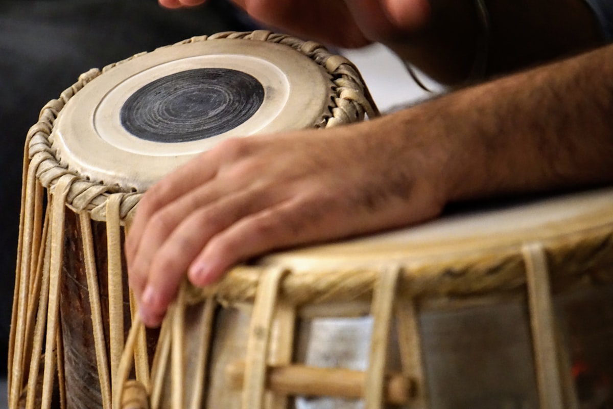 Artisan crafting an instrument in the workshop